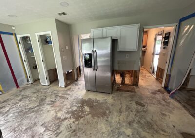 kitchen removal of damage flooring and portions of wall